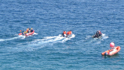 inflatables chasing Venus, off the Blasket island beach