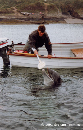 Playing with a paddle from a boat